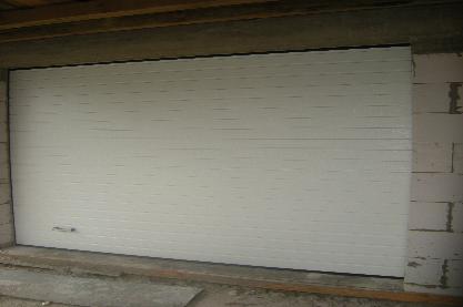 Ворота секційні автоматичні з торсійними пружинами.